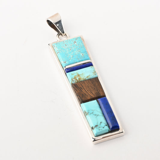 Sterling silver pendant with inlay of turquoise, lapis, and ironwood