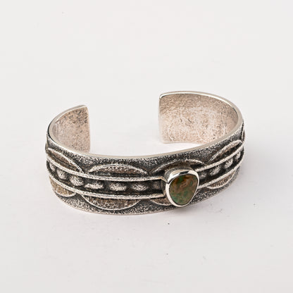 Sterling silver, Tufa-cast Cuff Bracelet set with a single Turquoise Stone